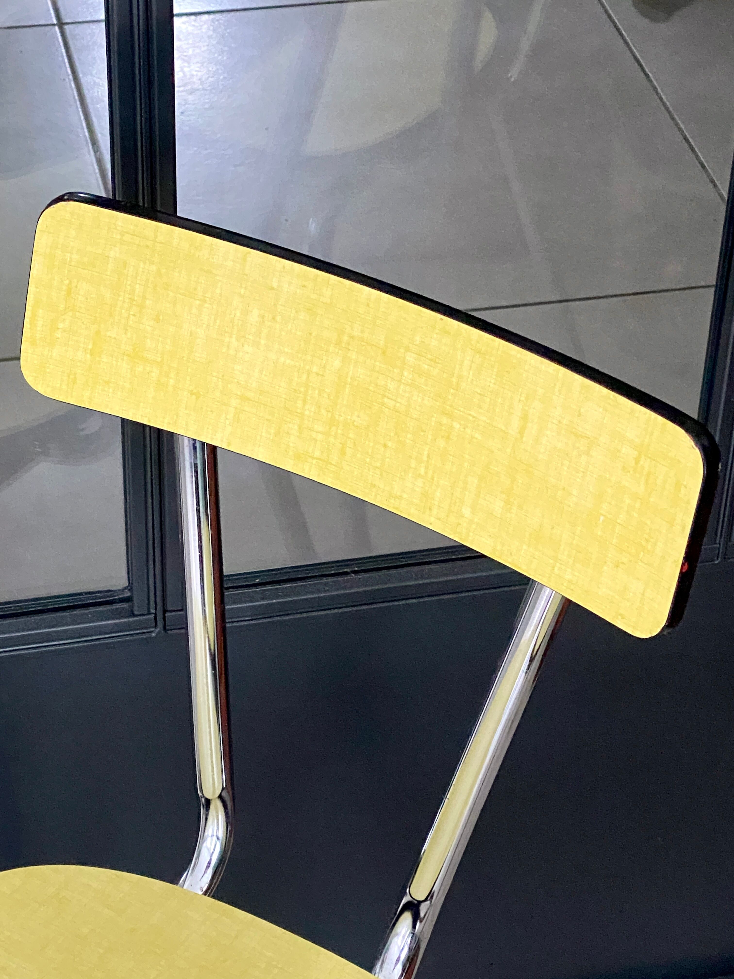 Pair of yellow formica chairs