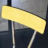 Pair of yellow formica chairs