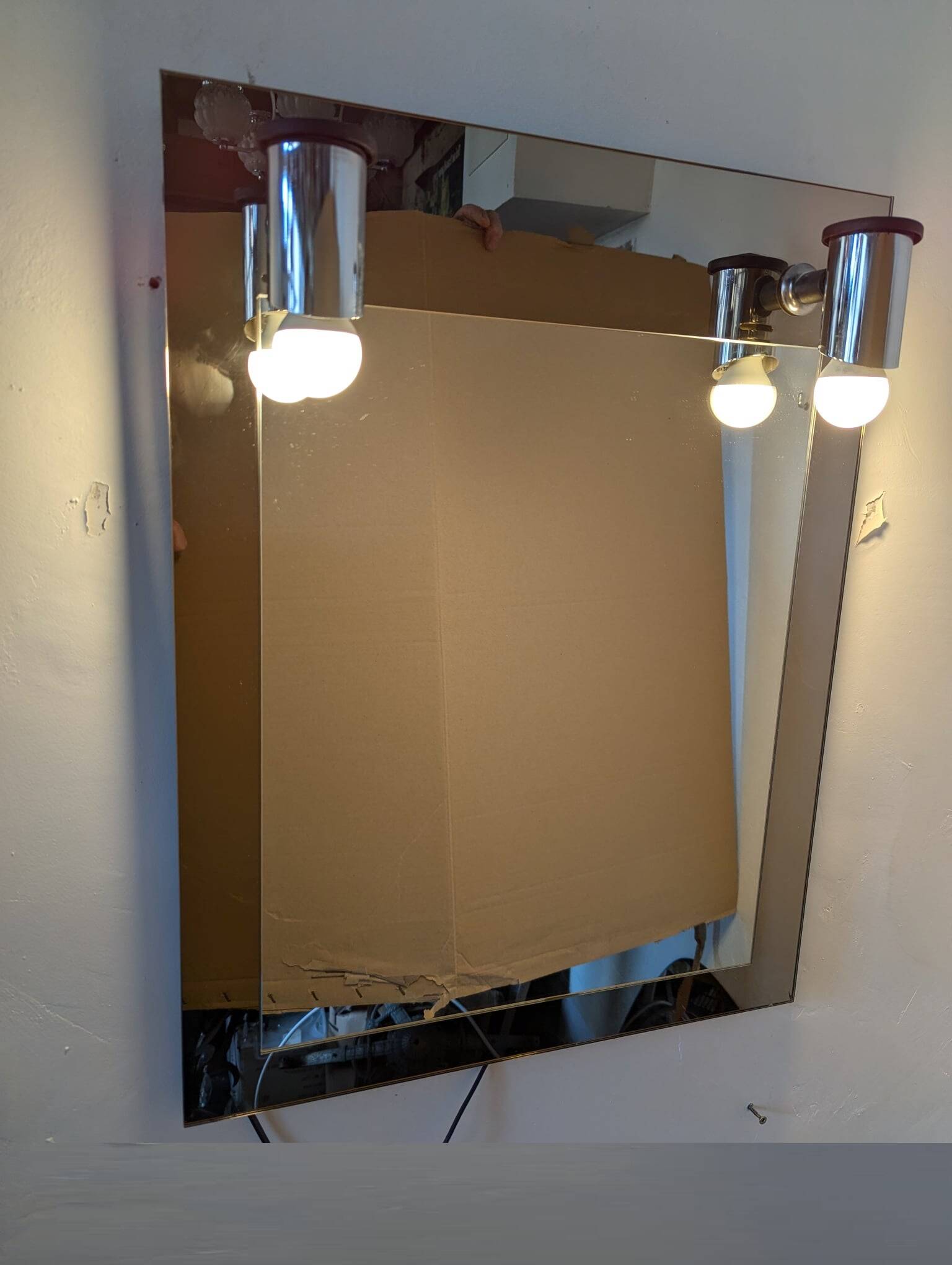 Vintage mirror with sconces.