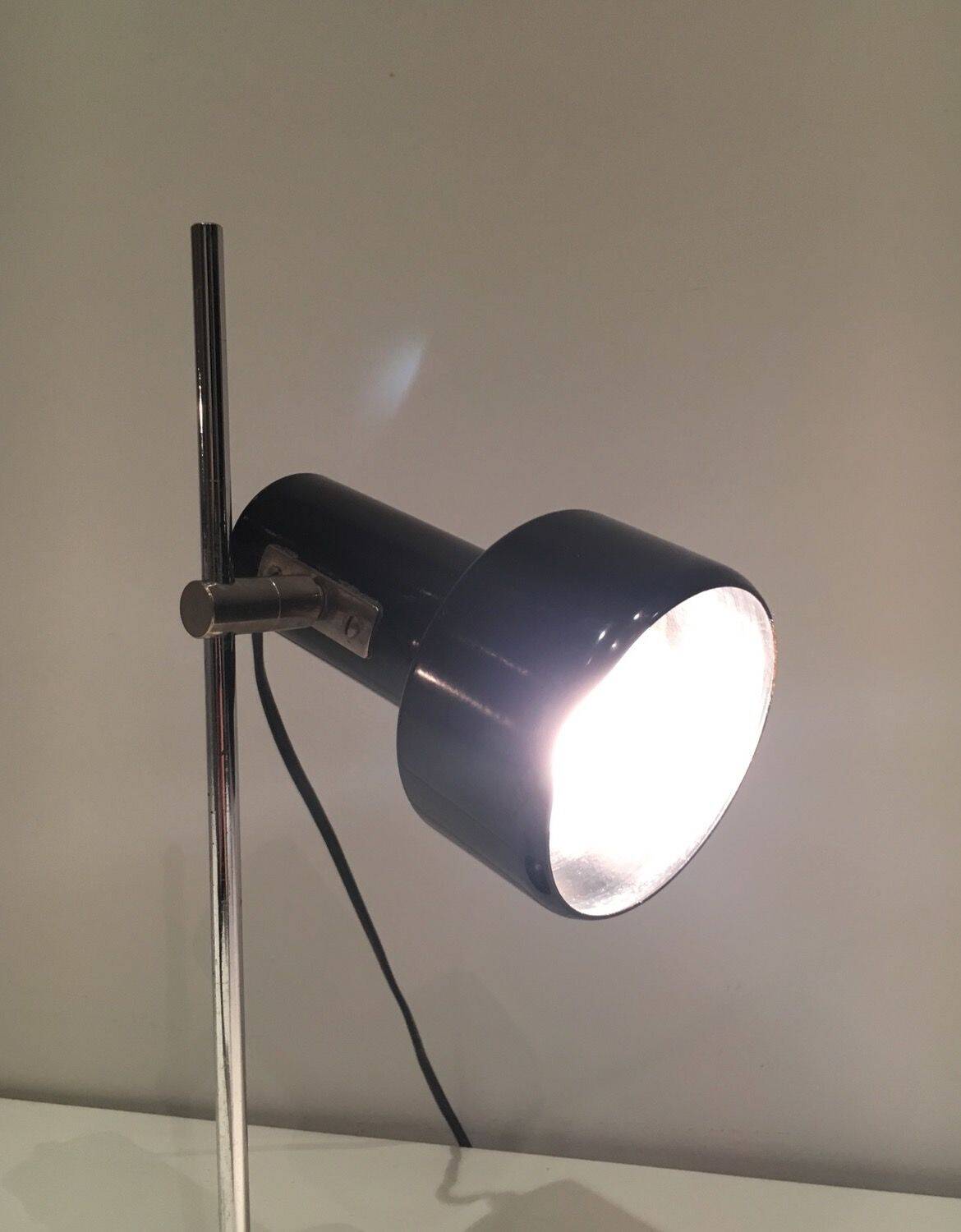 Adjustable lamp in black lacquered metal and chrome. French work. Circa 1970.