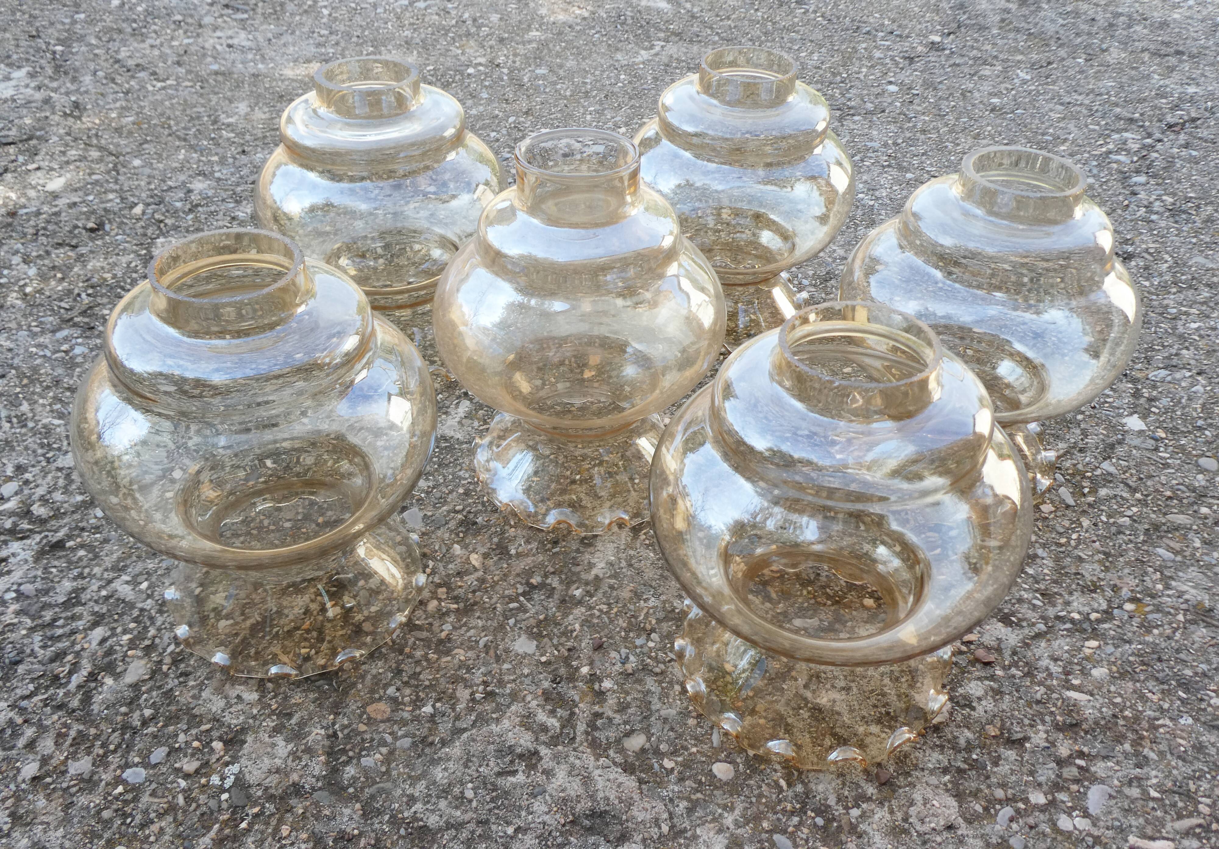 Set of 6 amber glass globes.