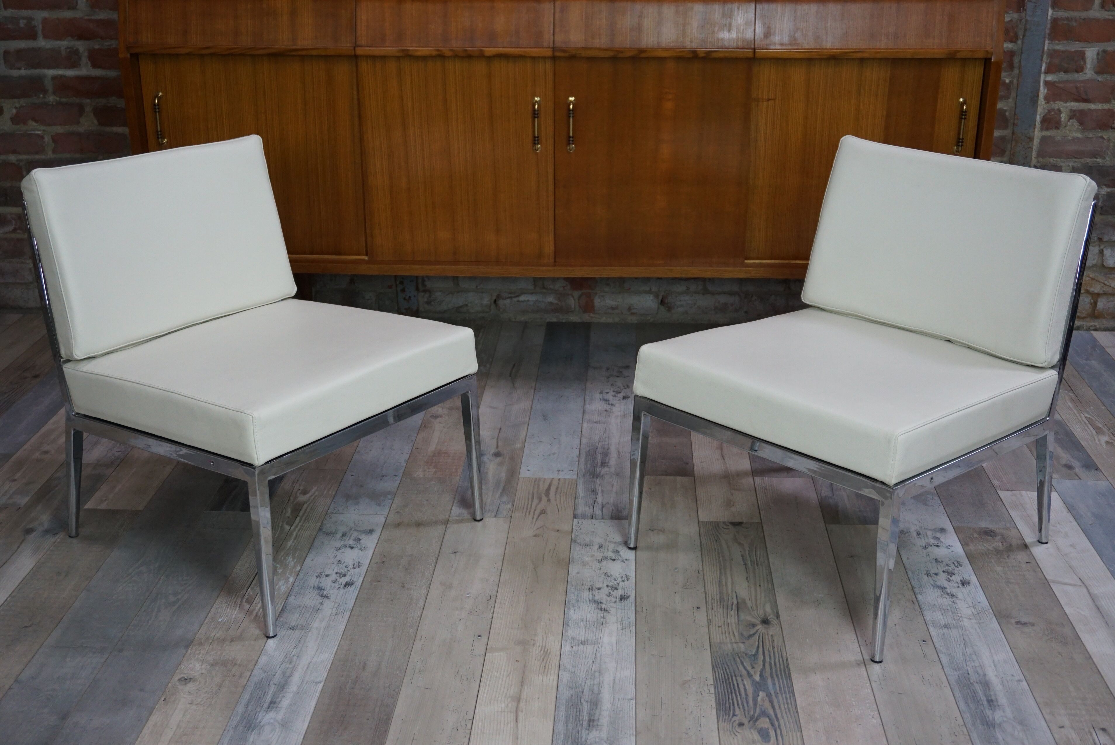 Pair of chrome and leather armchairs