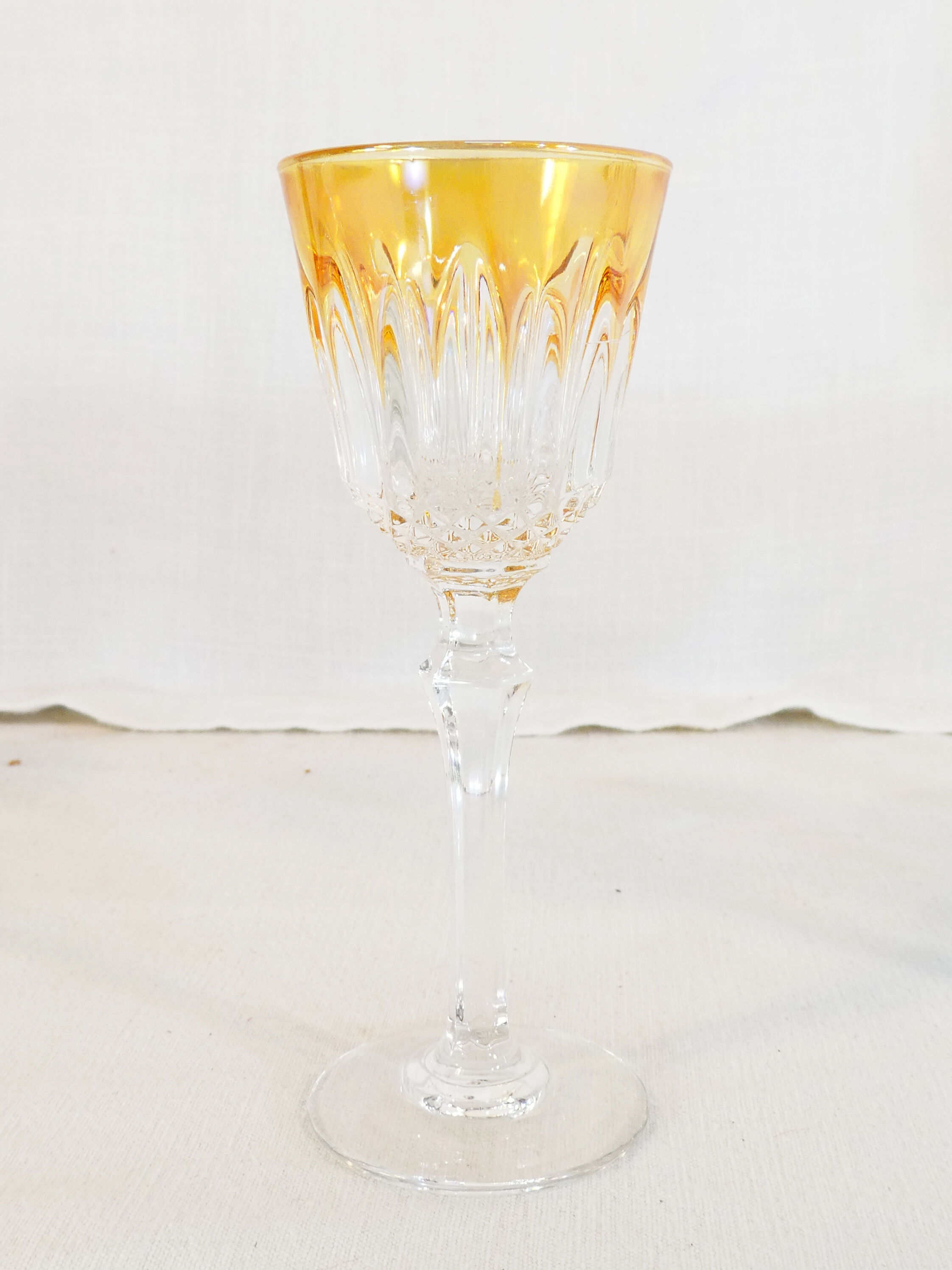 10 glasses with coloured liquor