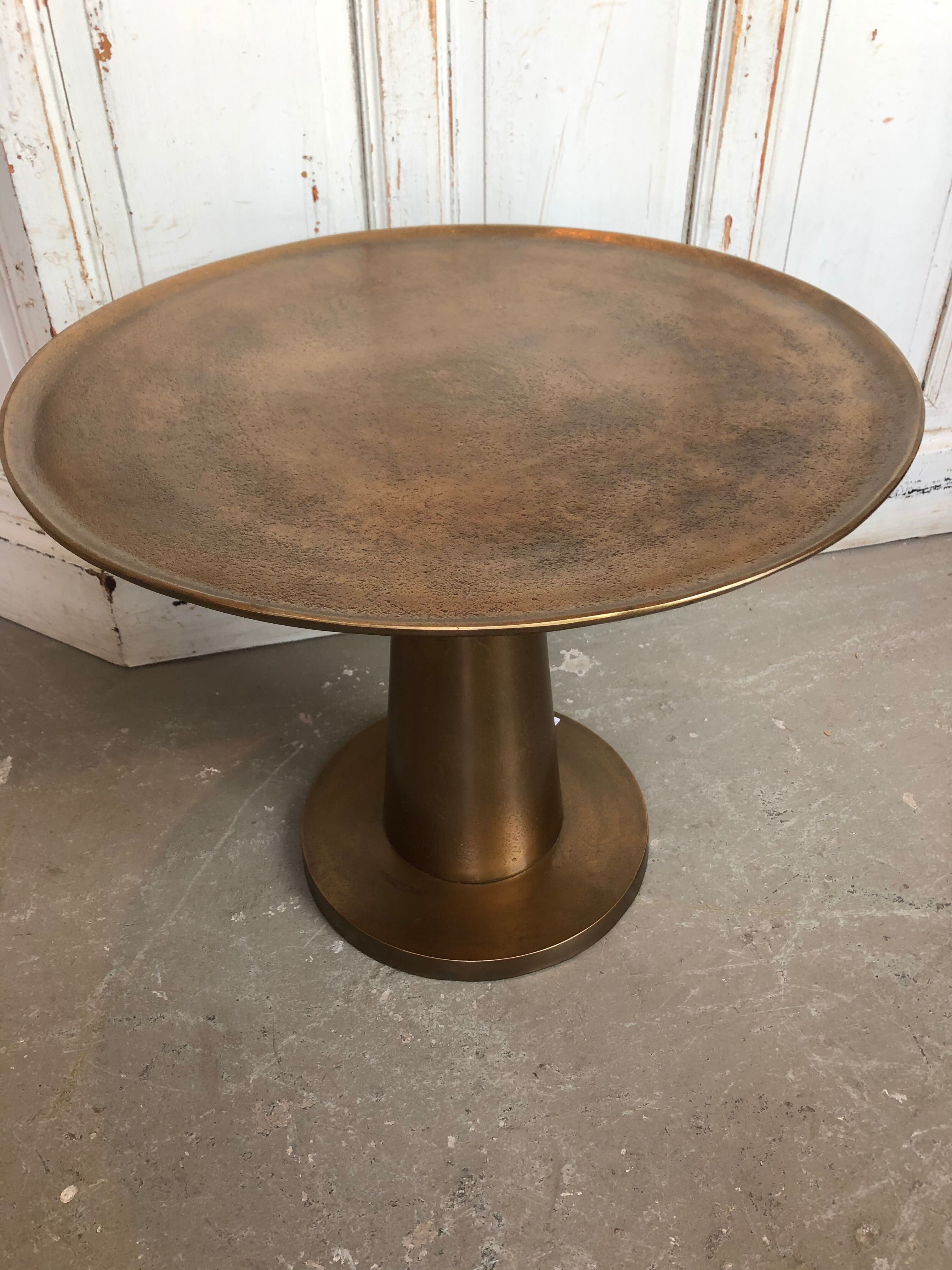 Gold-colored large round metal table