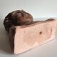 Bust old child in plaster stamped l.j.c.