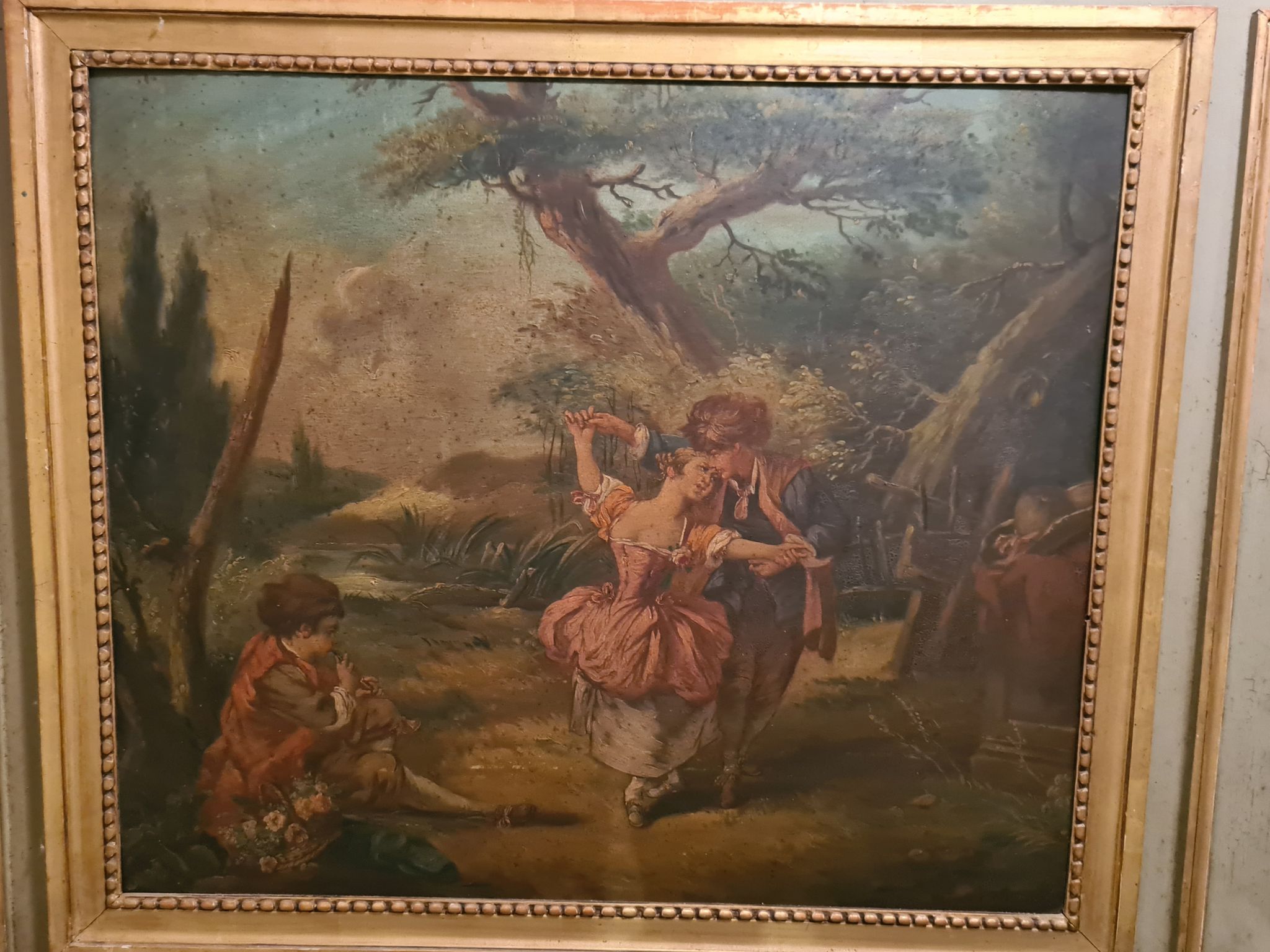 Lacquered wooden trumeau in the Louis XVI style, late 19th century.