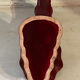 Ruby red ceramic pocket ashtray from Vallauris, numbered.