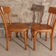 Pair of honey-colored bistro chairs