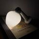 Swan neck wall light in ceramic with an opaline white glass globe.