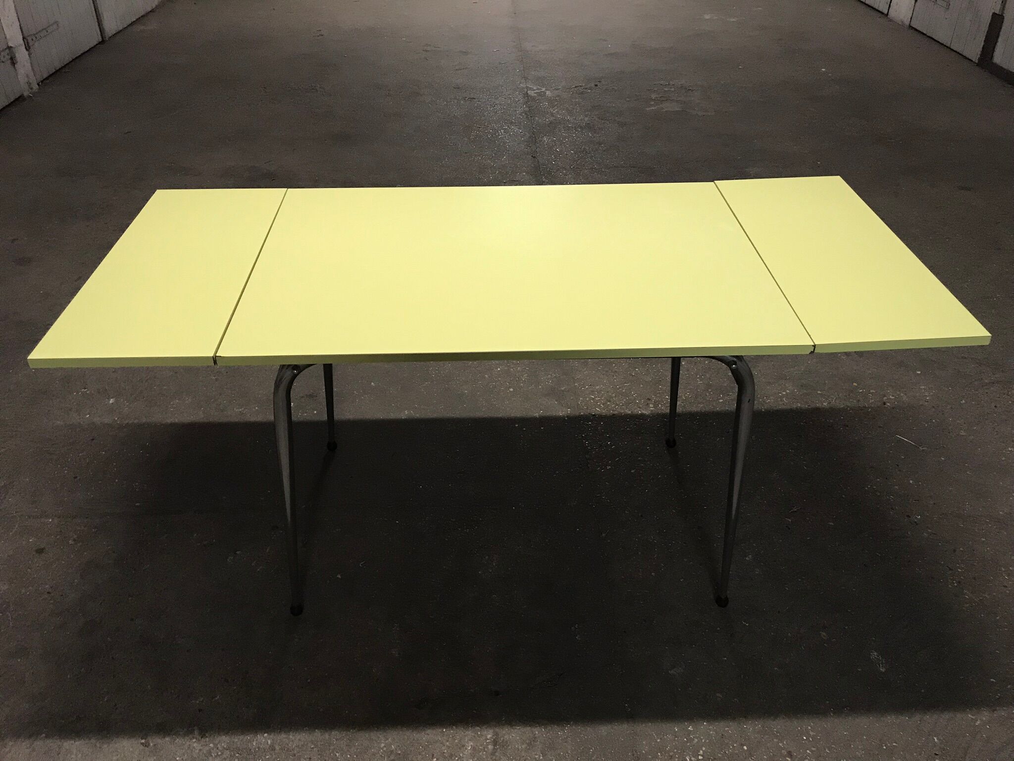 Yellow formica kitchen table with two extension cord, vintage 60s
