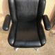 Vintage swivel black leather armchair