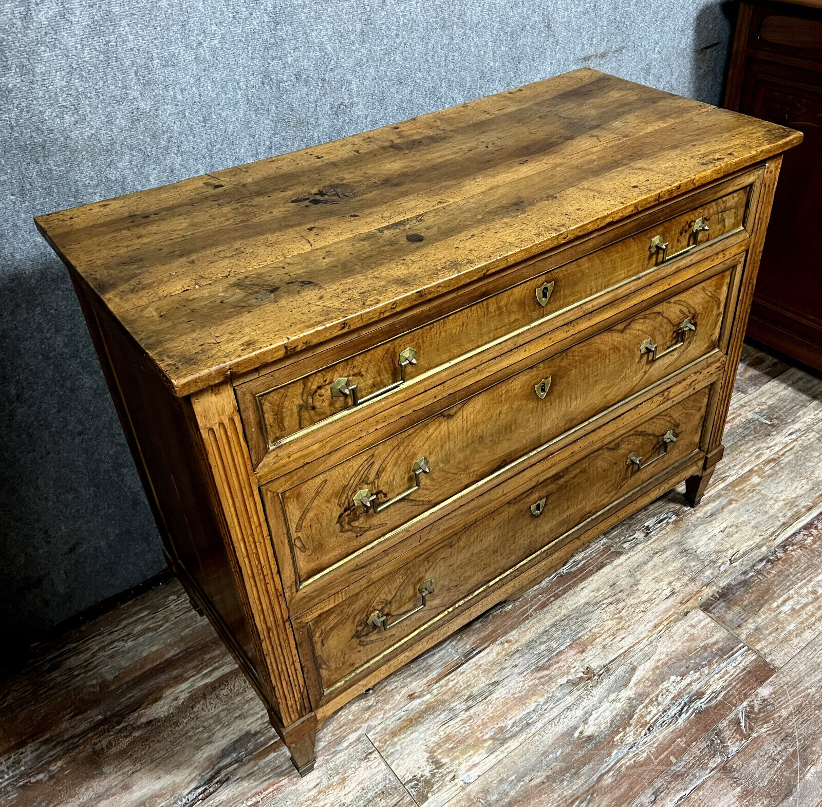 Louis XVI period chest of drawers in walnut and gilded brass nets circa 1780