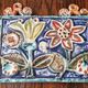 Art ceramic, towel holder with floral decoration signed Giovanni Desimone.