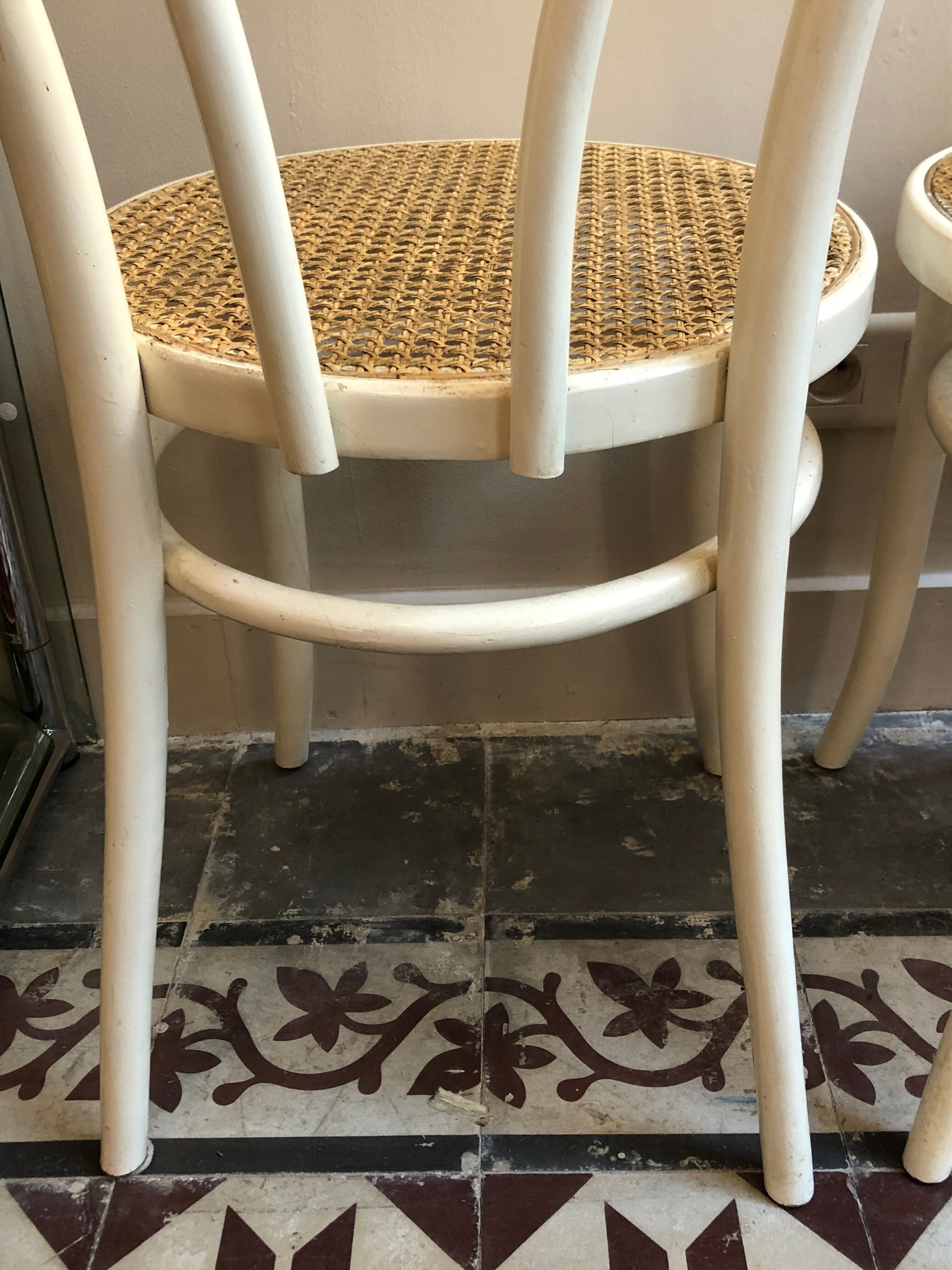 Couple of white bistro chairs