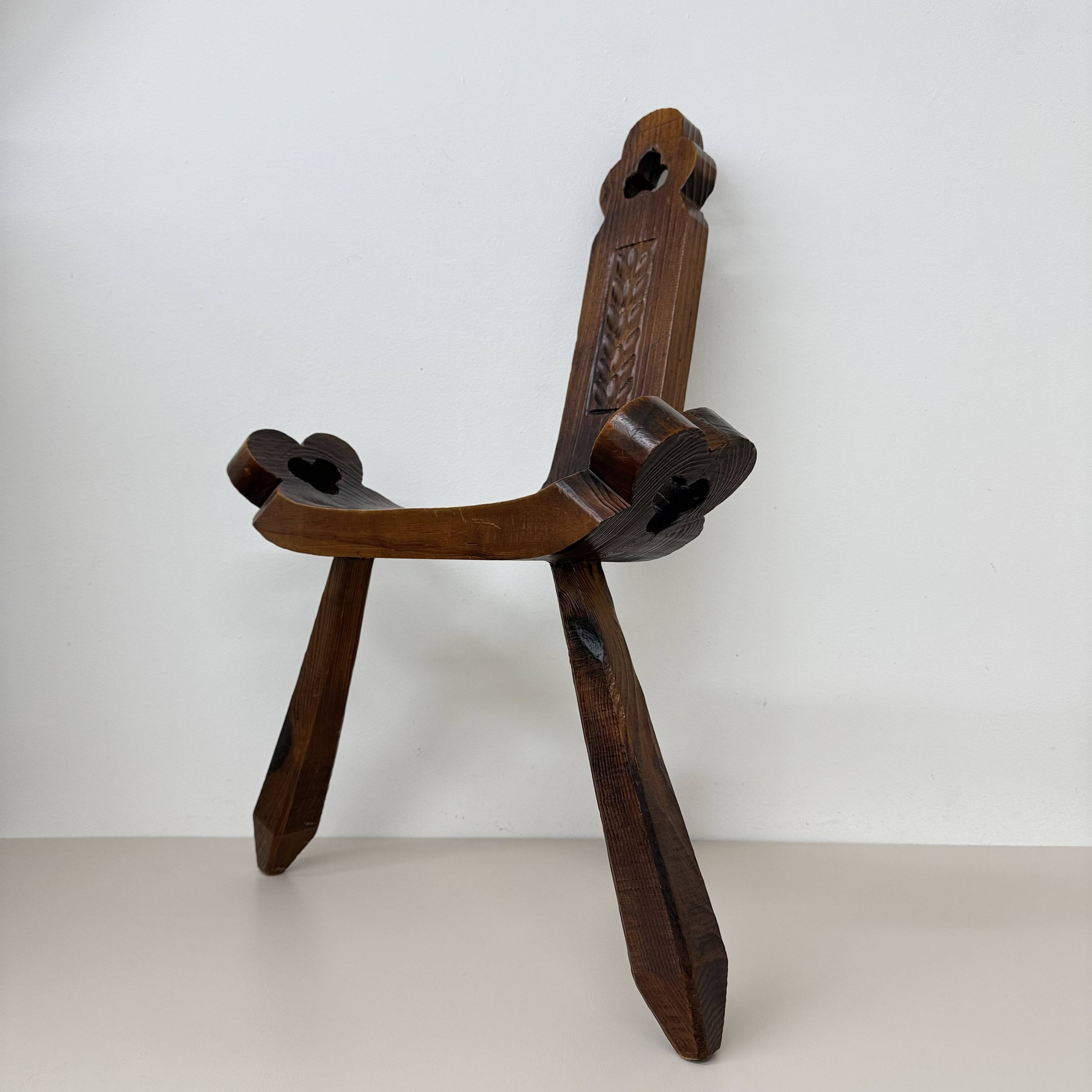 Brutalist hand carved oak Spanish tripod chair , 1970s
