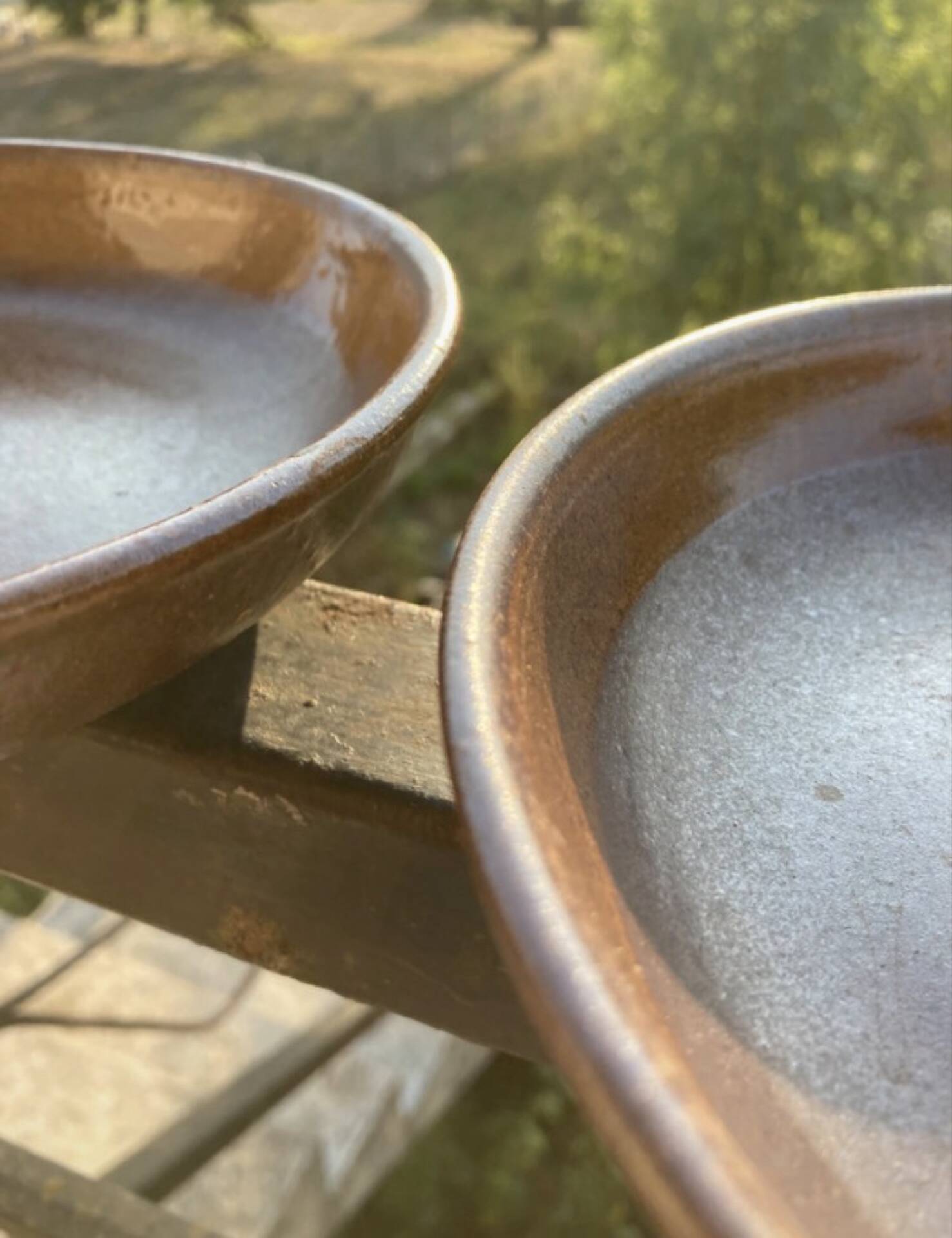 Deep plates made of organic, wild, earthy marsh clay.
