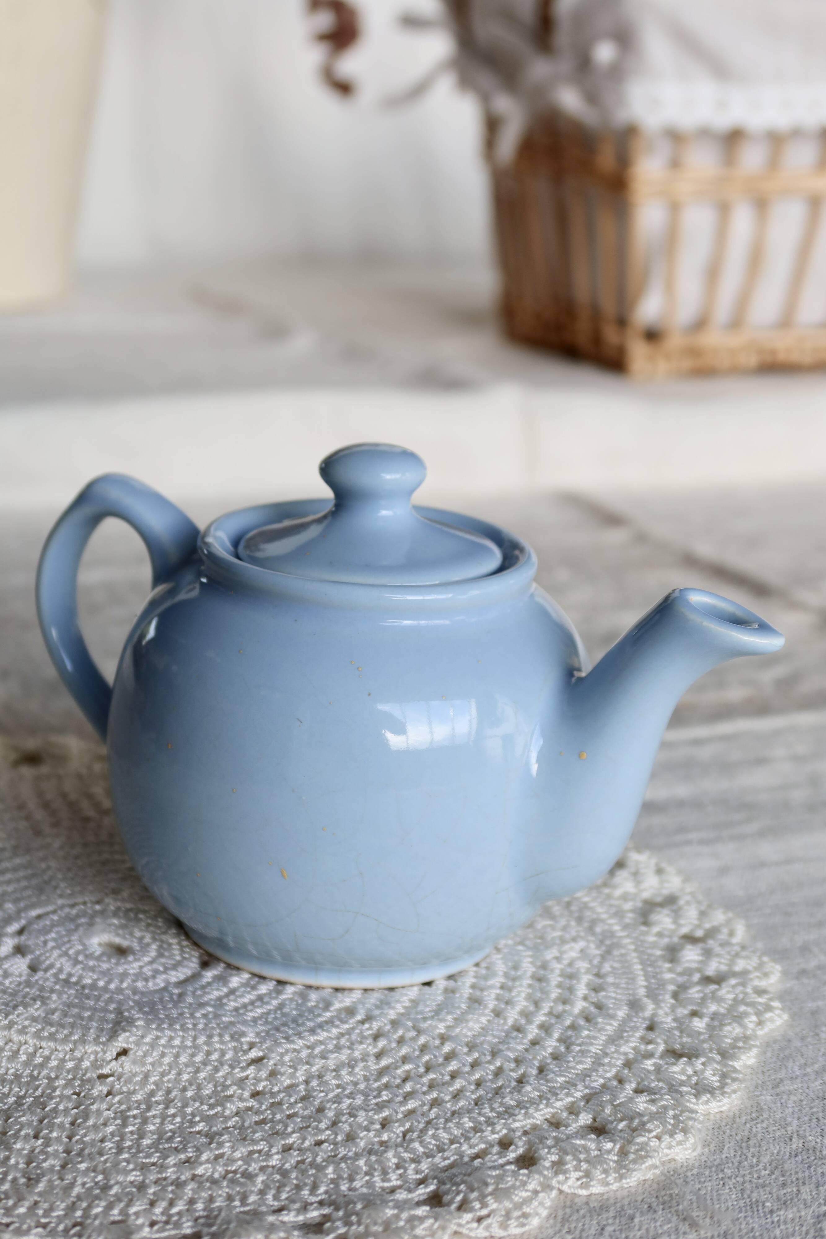 Small vintage sky-blue earthenware teapot