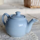 Small vintage sky-blue earthenware teapot