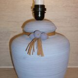 Vintage ceramic lamp foot with ball necklace and raffia.