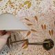 Brass wall lamp with vintage articulated arm, glass and brass shade
