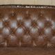 Chesterfield Regency 1810 antique canapé restored in leather with a carved frame.