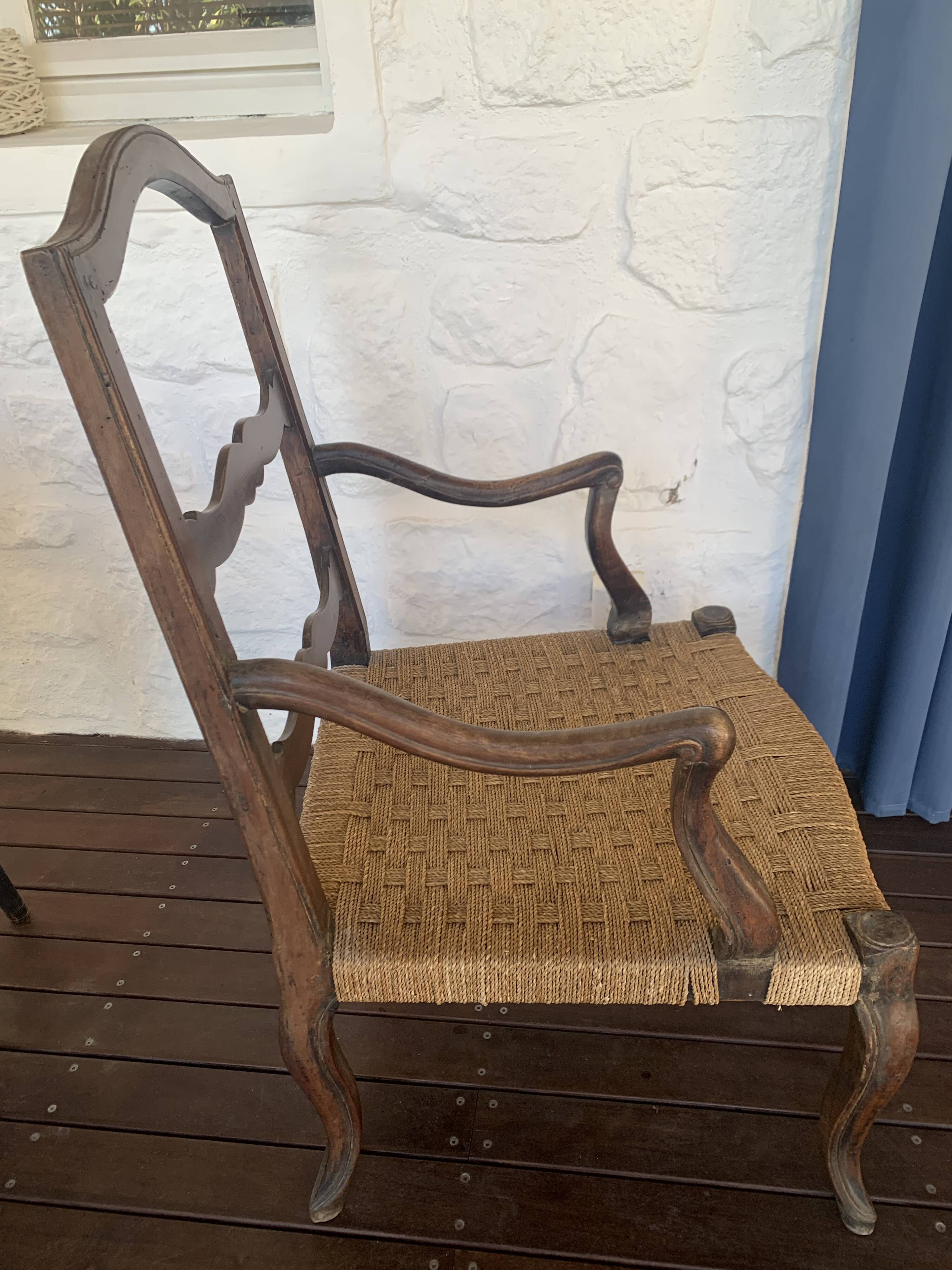Pair of antique wooden armchairs with woven seats + cushions