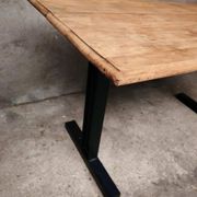 Unique wooden table with metal industrial legs.