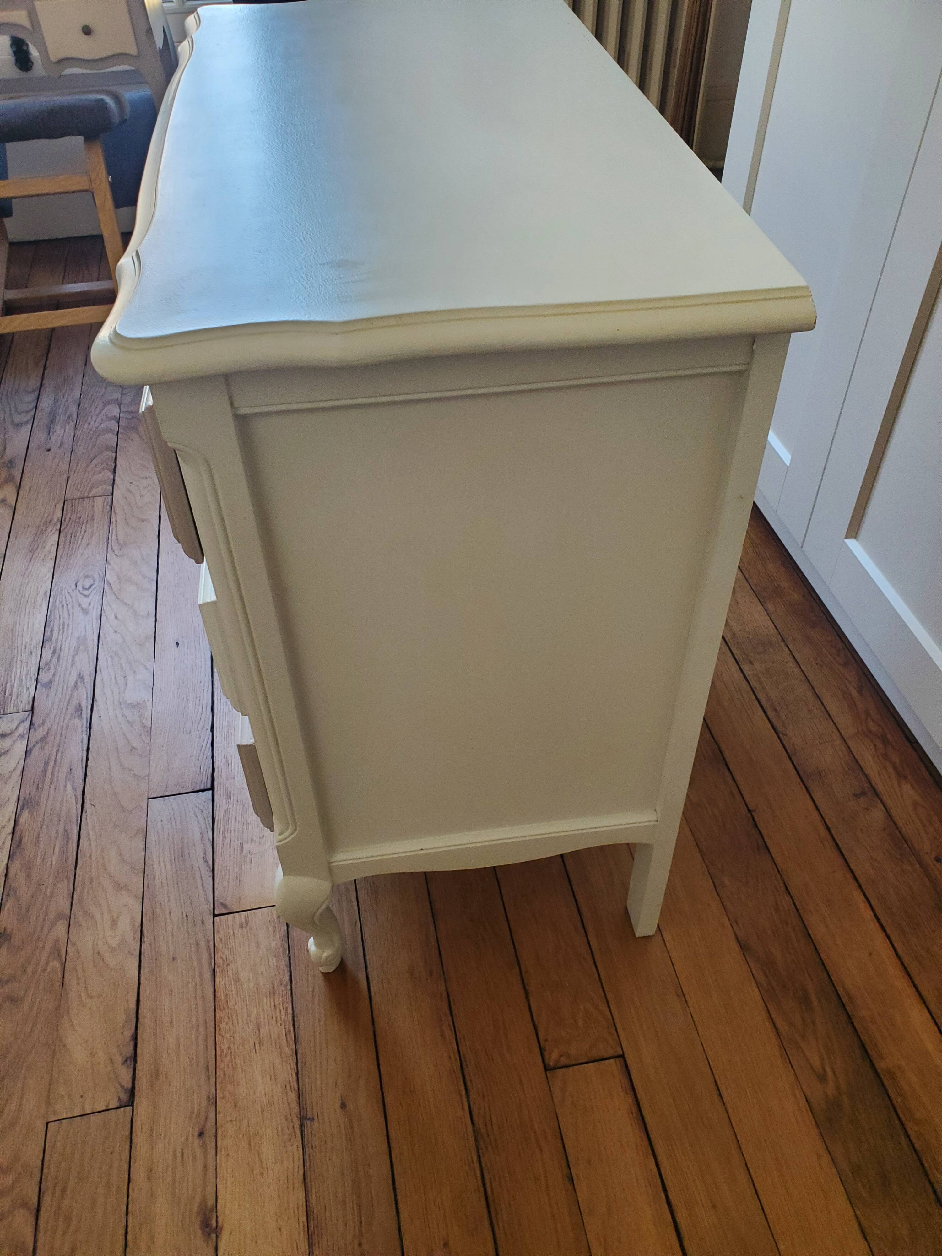 Dresser repainted in off-white and grey-pink colours.