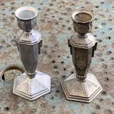 Pair of metal candlesticks, chiseled with a statuette in front, rose pattern in relief, art deco