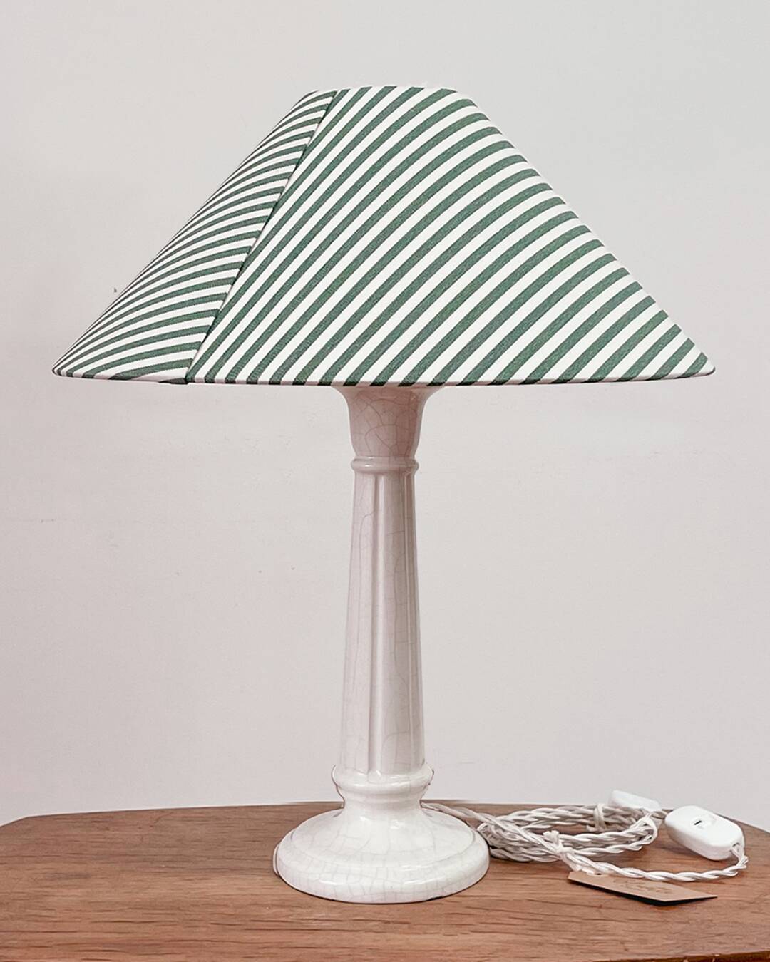 Earthenware lamp and striped lampshade