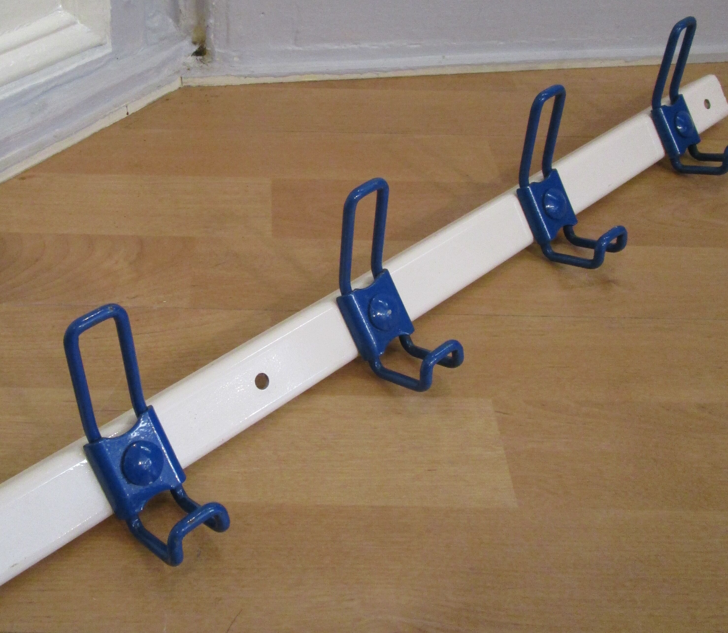 White and blue lacquered steel wall coat holder