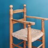 Children's high chair made of wood and straw