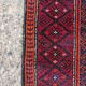 Vintage hand-knotted Persian Baluch prayer rug from the 1940s.