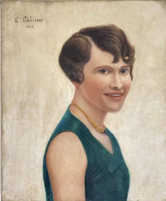 Portrait of a woman, signed Debiesse dated 1928