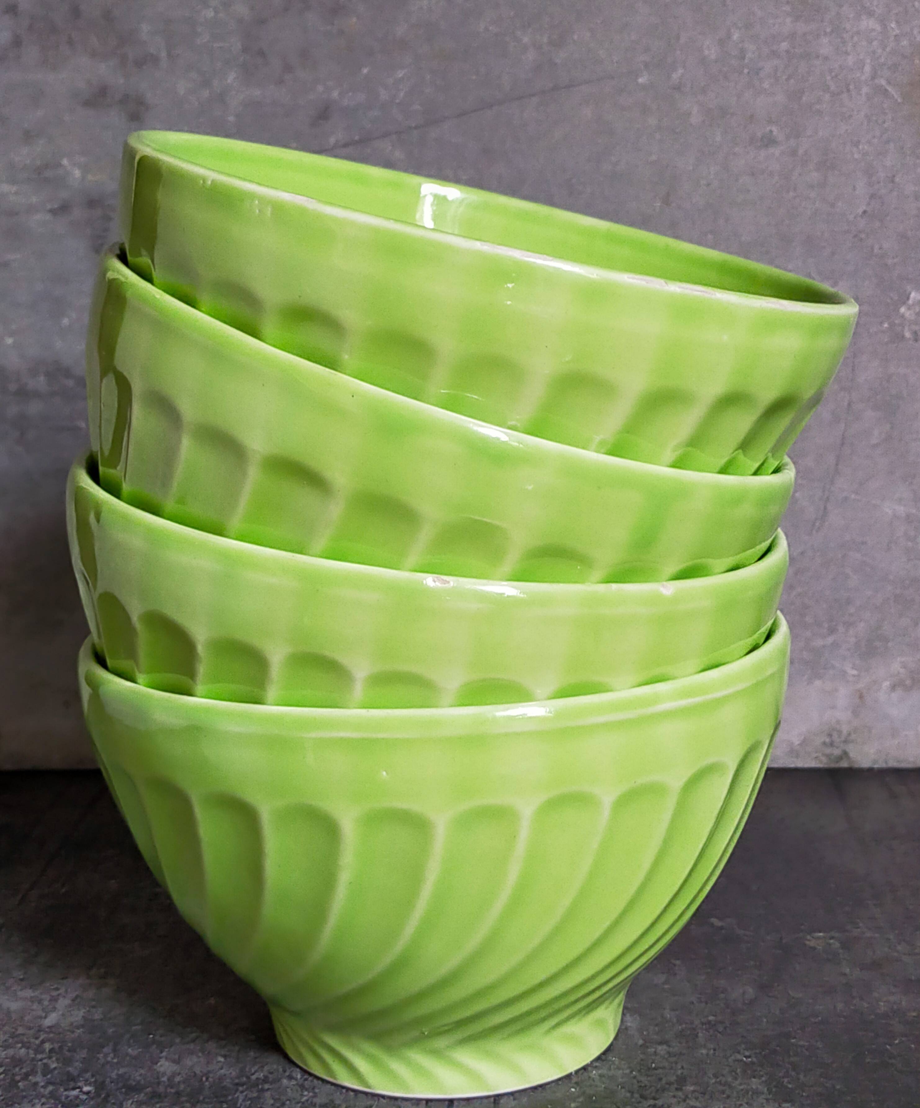 Four vintage spring green earthenware bowls