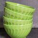 Four vintage spring green earthenware bowls