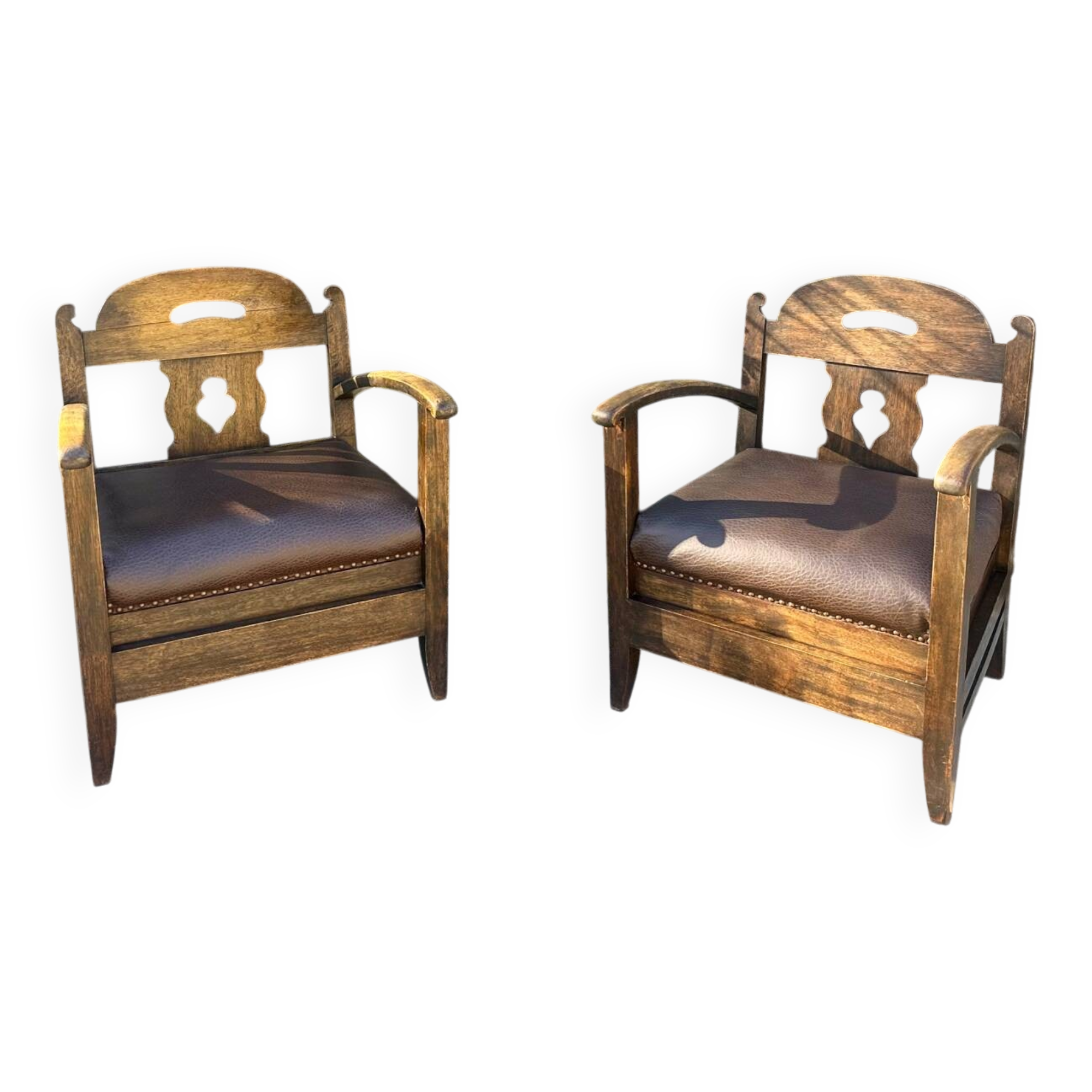Pair of armchairs in stained wood and leather, 20th century