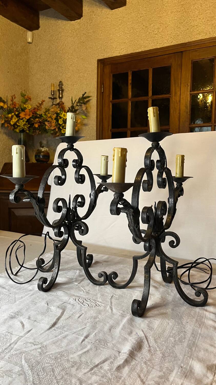 Pair of 3-light wrought iron candlesticks on vintage legs