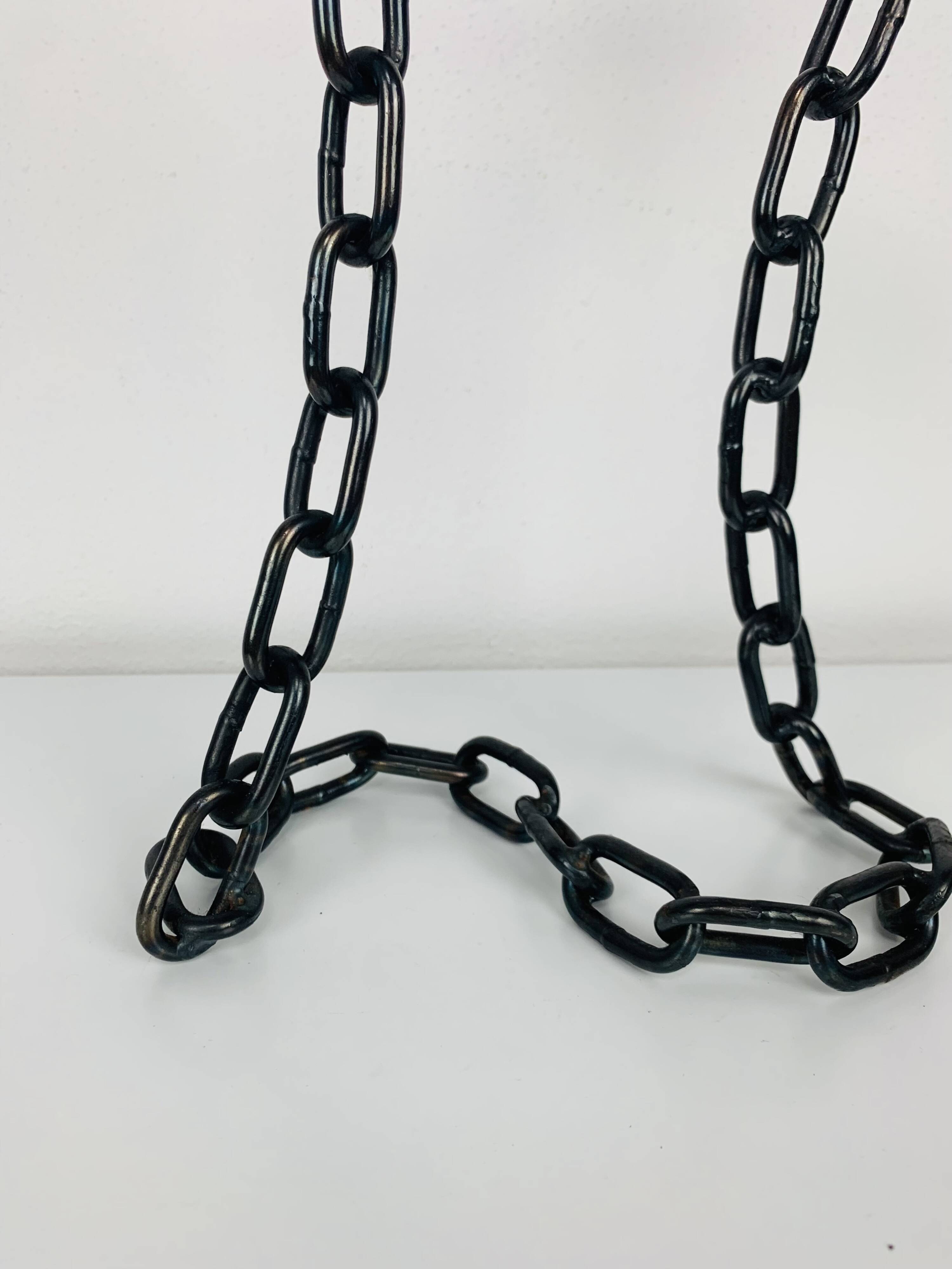 Brutalist and sculptural candle holder in wrought iron, chain links
