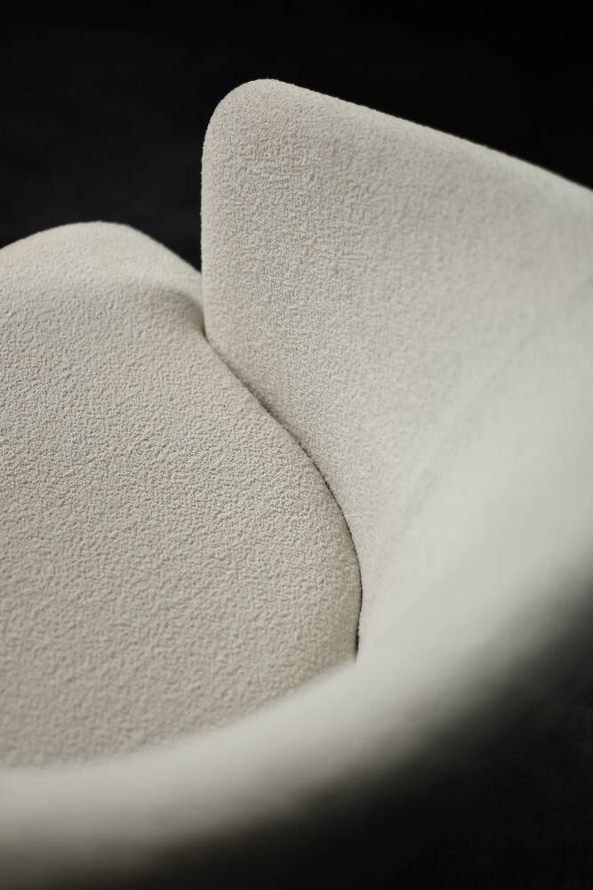 Low oak armchair with modern mid-century Scandinavian fabric and rounded backrest, 1960s.