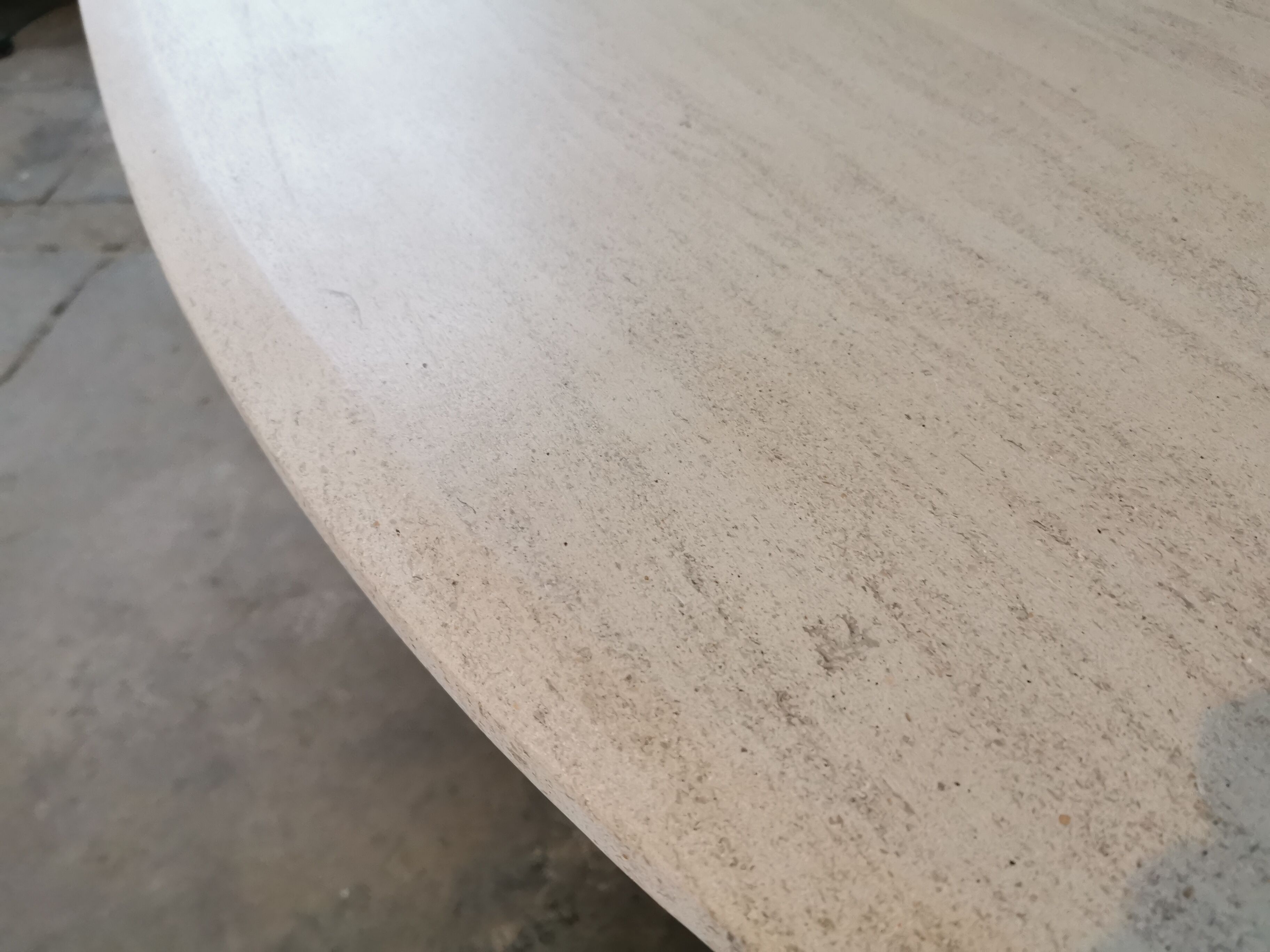 Large oval coffee table in travertine and metal