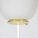 Floor lamp in opaline, lacquered metal and golden brass. 1950s.