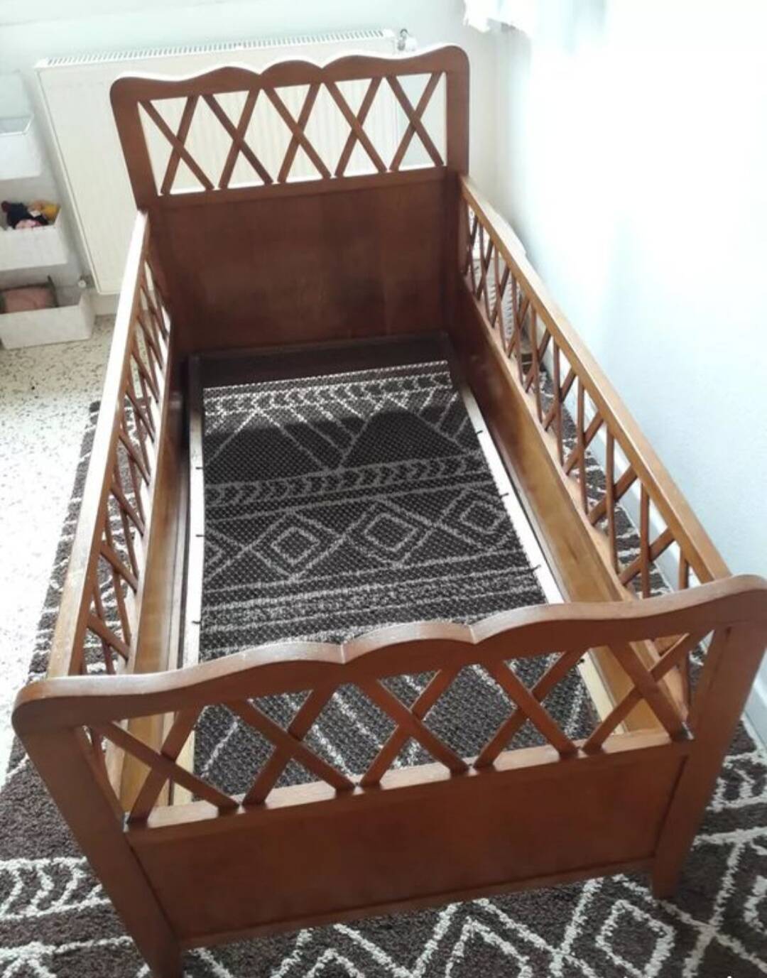Vintage wooden baby cot from the 1960s.