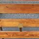 Wall-mounted coat rack in iron and wooden slats