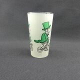 Glass illustrated by Cabu on the theme of the circus, 3 learned monkeys on a bike, green
