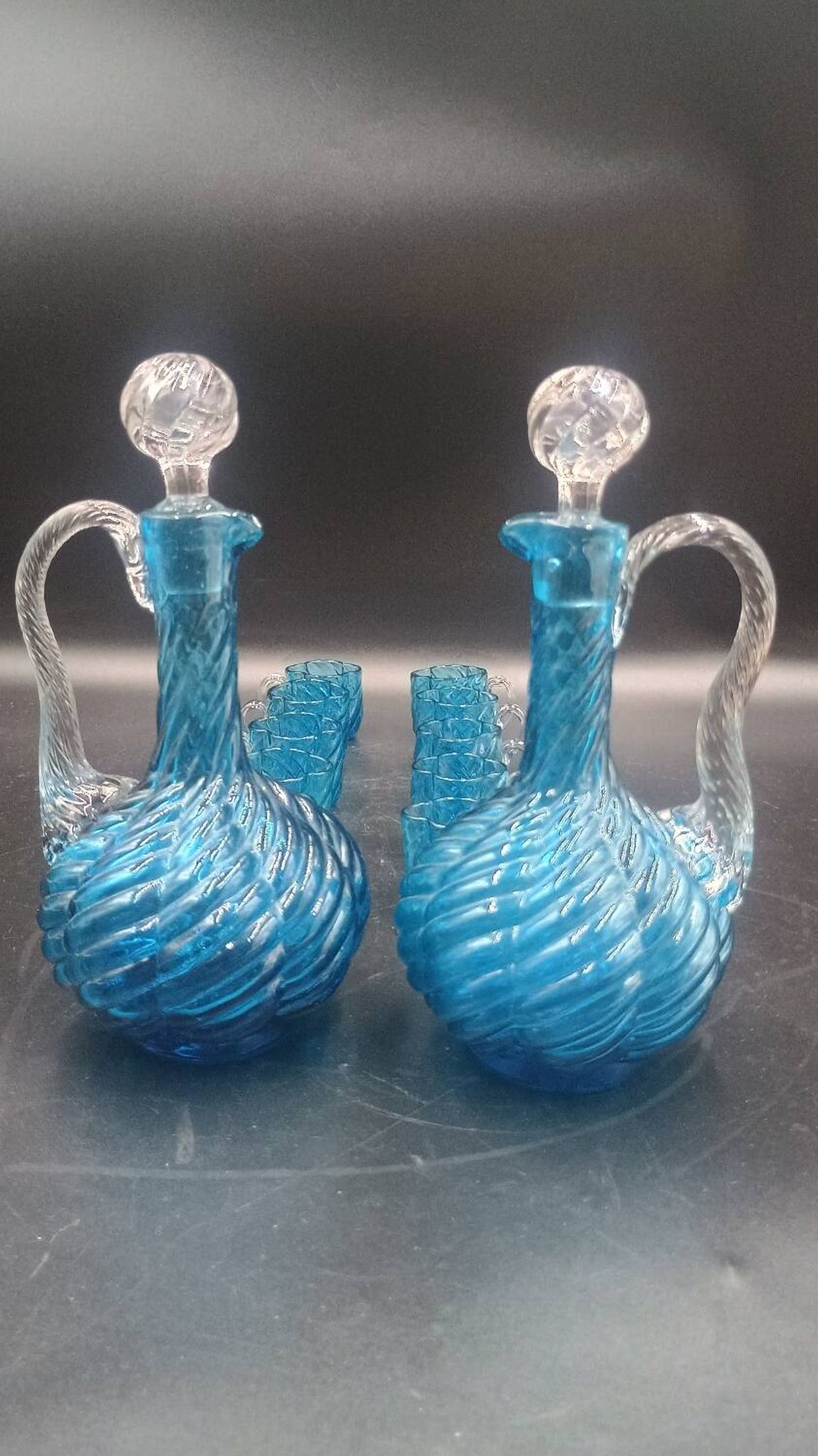 Cabaret Portieux liqueur service with 10 blue and clear glasses.