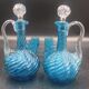 Cabaret Portieux liqueur service with 10 blue and clear glasses.