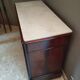 Victorian commode with a white marble top.