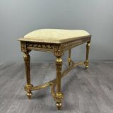 Antique gilded wooden bench in Louis XVI style, 19th century.