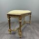 Antique gilded wooden bench in Louis XVI style, 19th century.